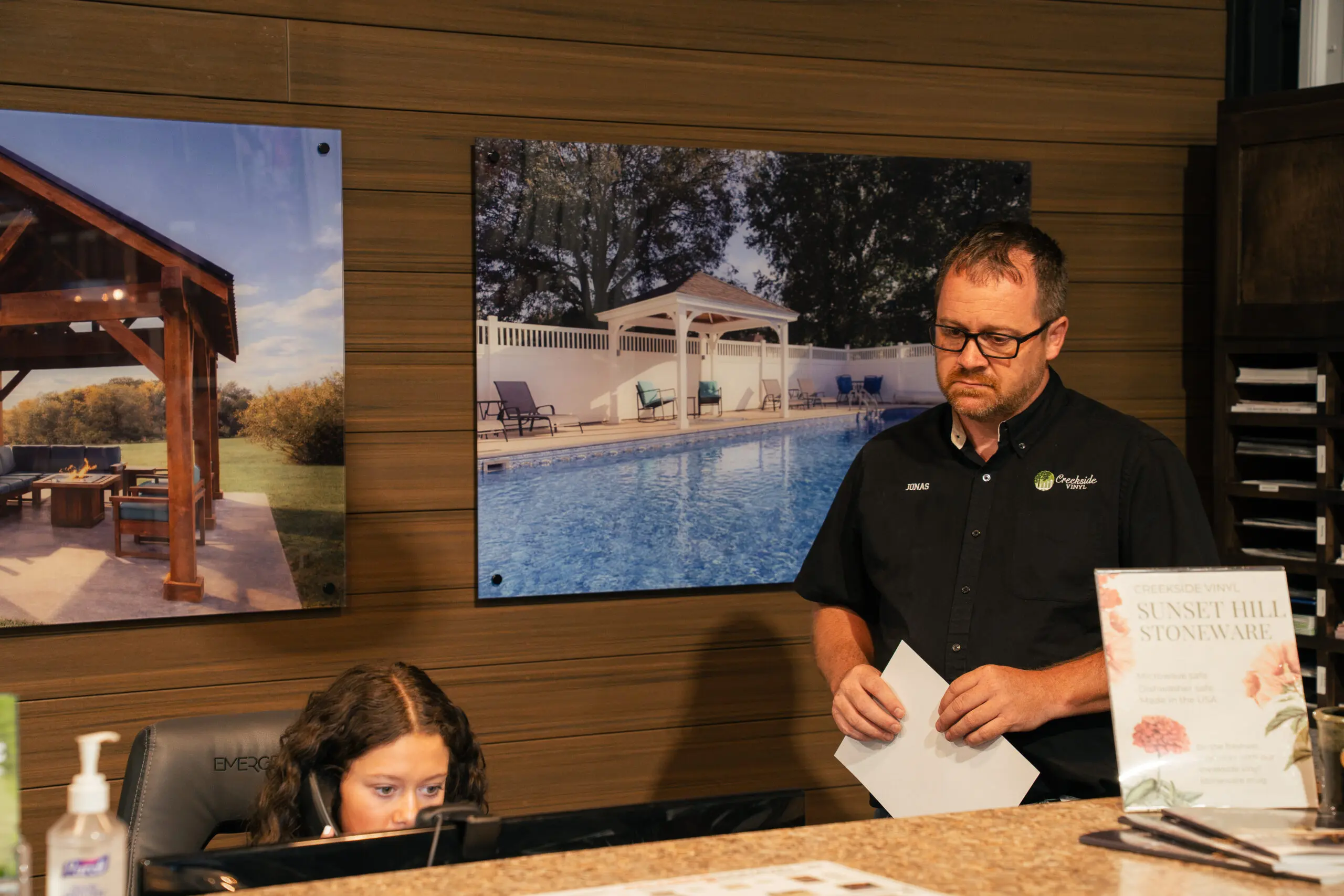 A Creekside team member helping a customer at the showroom counter