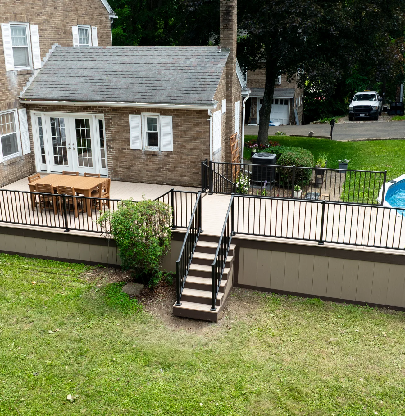 The same backyard with the new composite deck
